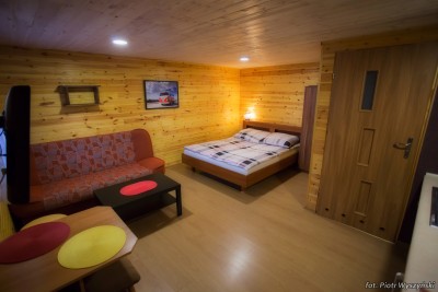 Łóżko w pokoju - domek letniskowy Domki DOLPAKART
