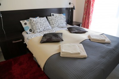 Apartament Apartament AMS - łóżko w pokoju