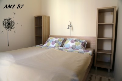 Zdjęcie przedstawia spanie w pokoju - Apartament AMS | Rewal (wypoczywaj nad morzem) 