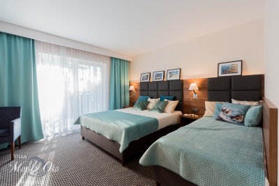 Zdjęcie przedstawia łoże w pokoju - Villa MORSKIE OKO | Pogorzelica (wypoczywaj nad morzem) 