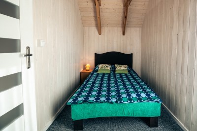 Zdjęcie przedstawia łoże w domku letniskowym Fantazja