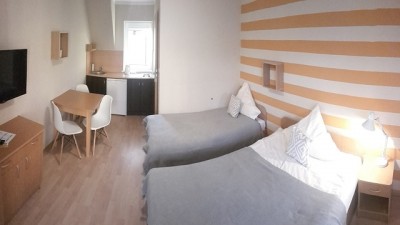 Apartament AKWAMARYN SPA Niechorze - łóżko w pokoju
