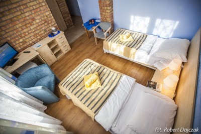 Fotografia przedstawia łóżko w pokoju Ośrodek MEWA