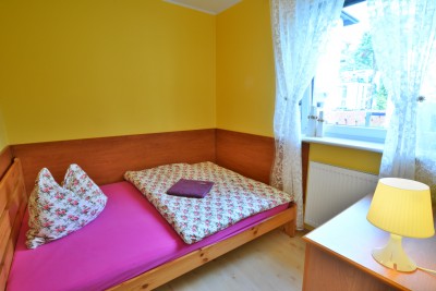 Fotografia przedstawia spanie w apartamencie Apartament SOSNÓWKA