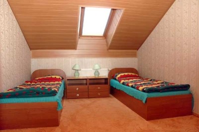 Zdjęcie przedstawia łóżko | pensjonat POLONIA SPA - BASEN. Pomorze Zachodnie