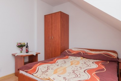 Fotografia przedstawia łóżko | pokój U KAZI. Pomorze Zachodnie