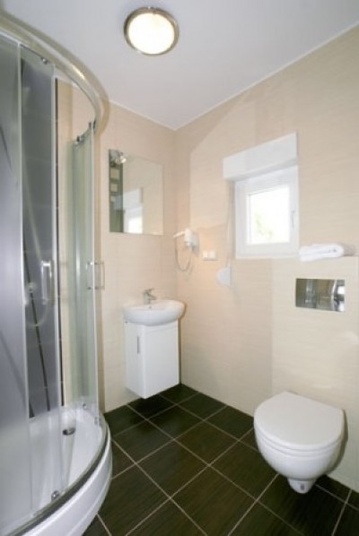 Tak prezentuje się łazienka w apartamencie Apartamenty POD MUZAMI (ul. Piastowska 14, 72-344 Rewal)