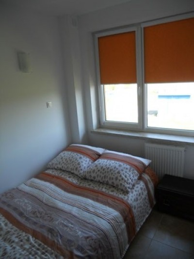 Na zdjęciu przedstawiony jest pokój w domku letniskowym Domki - Apartamenty La Mar (ul. Wypoczynkowa 4/6, 76-034 Sarbinowo, woj. zachodniopomorskie)