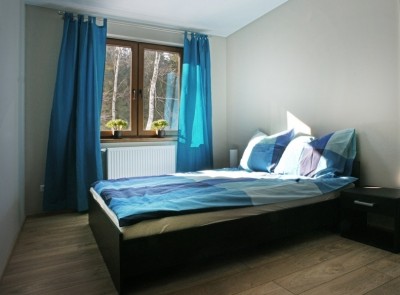Zdjęcie przedstawia łoże w pokoju - Apartamenty POD IZBICĄ | Karpacz (wypoczywaj w górach) 