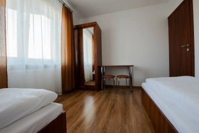 Fotografia przedstawia łóżko w pokoju - Dom Gościnny MARTA | Pobierowo (wypoczywaj nad morzem) 