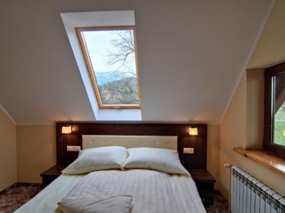Na zdjęciu łóżko w pokoju - NOWA Królowa Karkonoszy | Karpacz (wypoczywaj w górach) 
