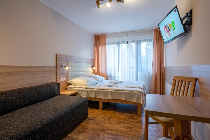 pokój Ośrodek Wypoczynkowy HALNY - łoże Fotografia przedstawia łóżko w pokoju Ośrodek Wypoczynkowy HALNY